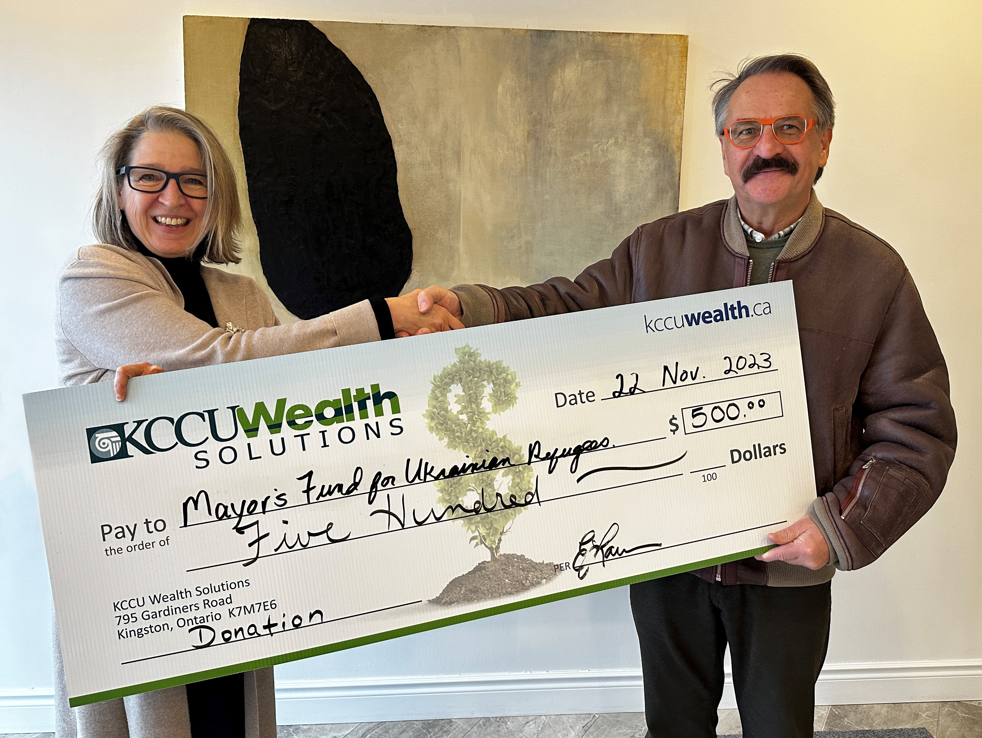 Anne Gillis presents large cheque to male representative